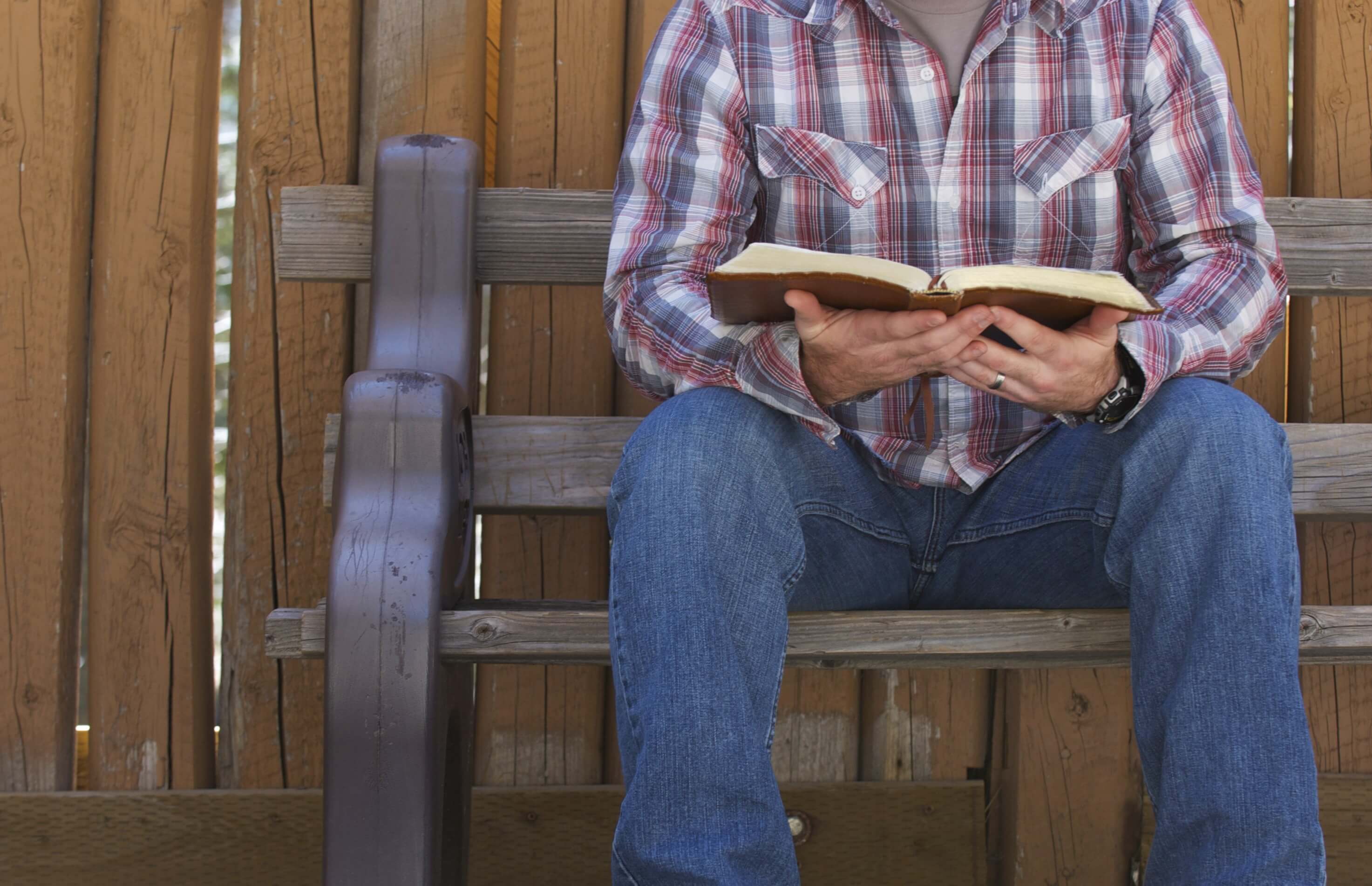 Man Reading the Holy Bible